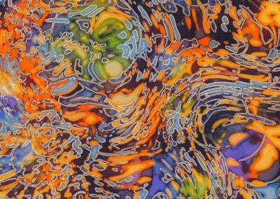 Abstract swirling pattern with vibrant orange, green, blue, and purple colors intertwined in dynamic, flowing shapes.